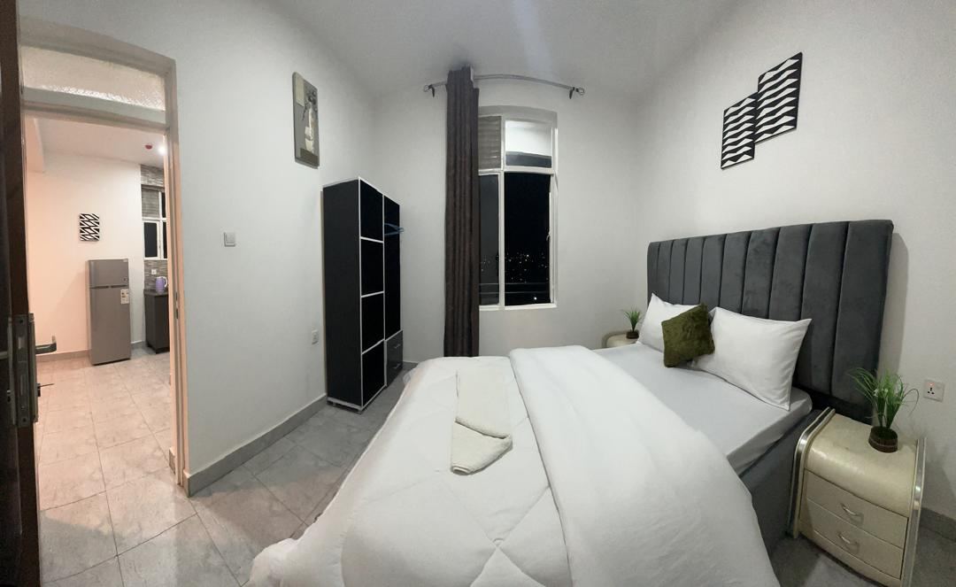Bedroom with city view window